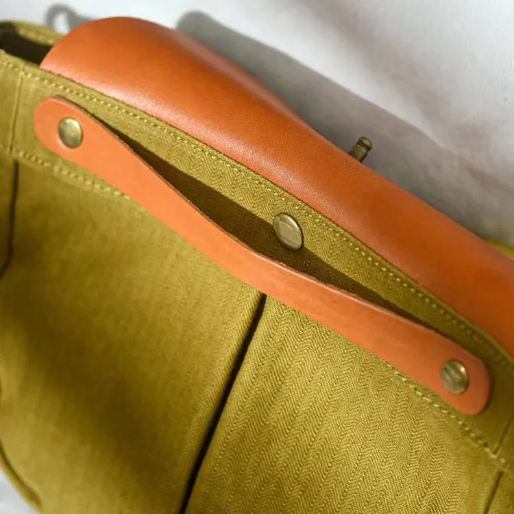 Saddle style canvas leather bag